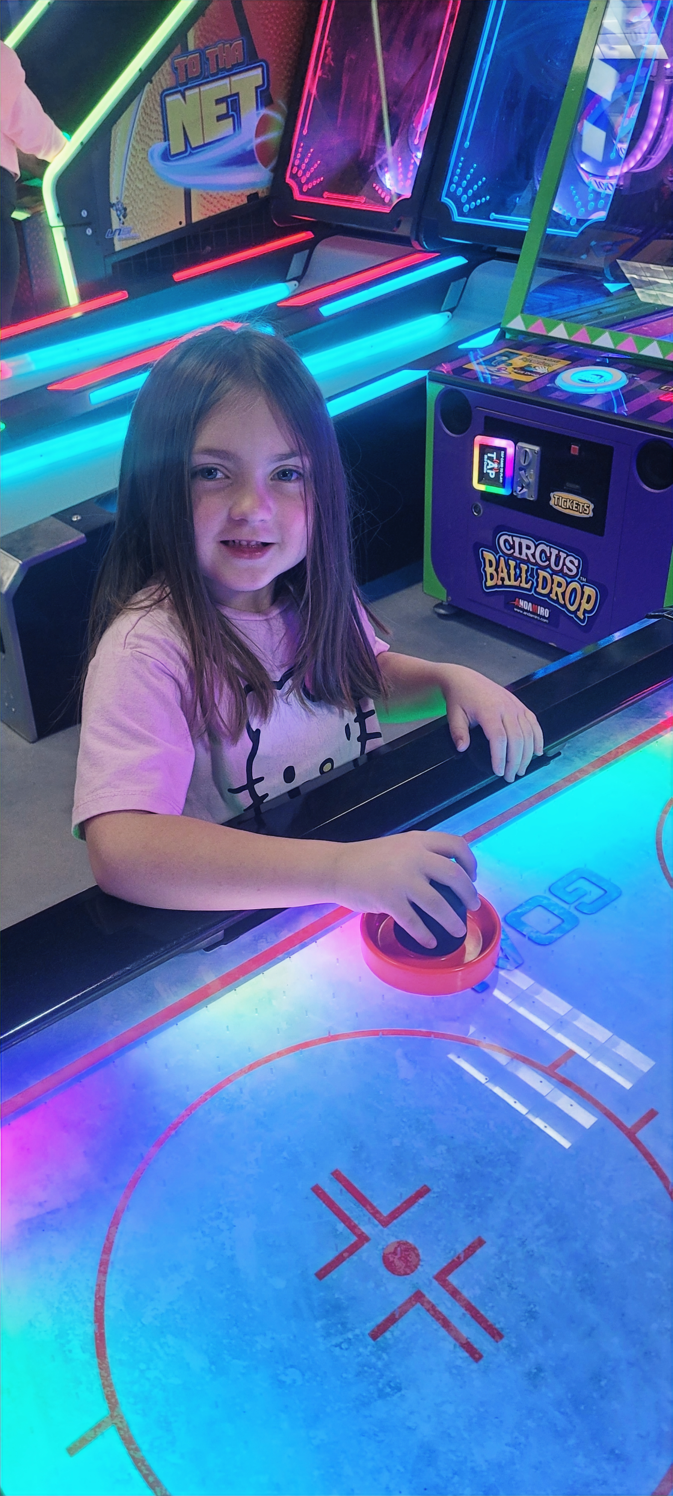 A colorful arcade game scene inside Level 99 Arcade.